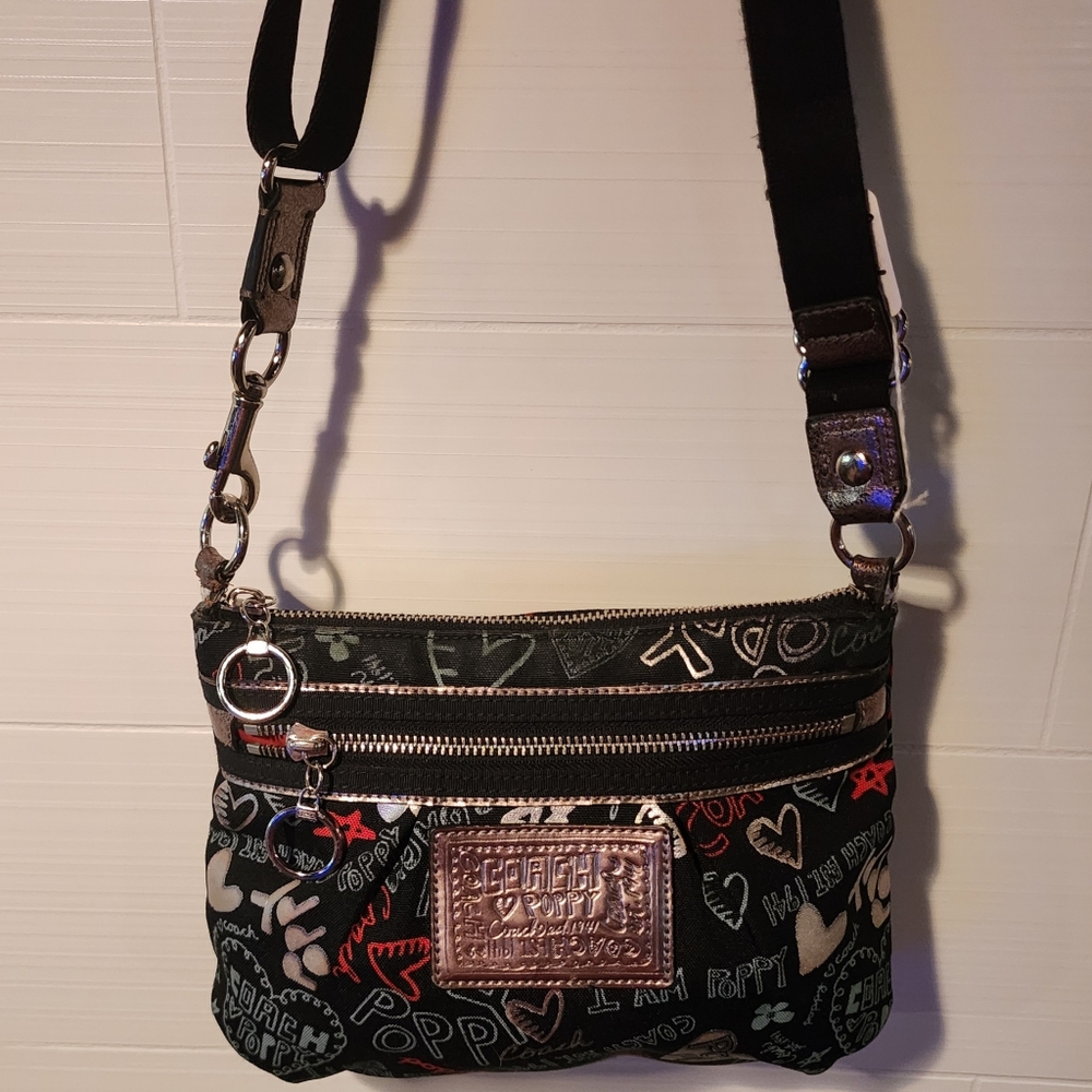 Coach Poppy Graffiti CrossBody has fraying on the loop of the clasp